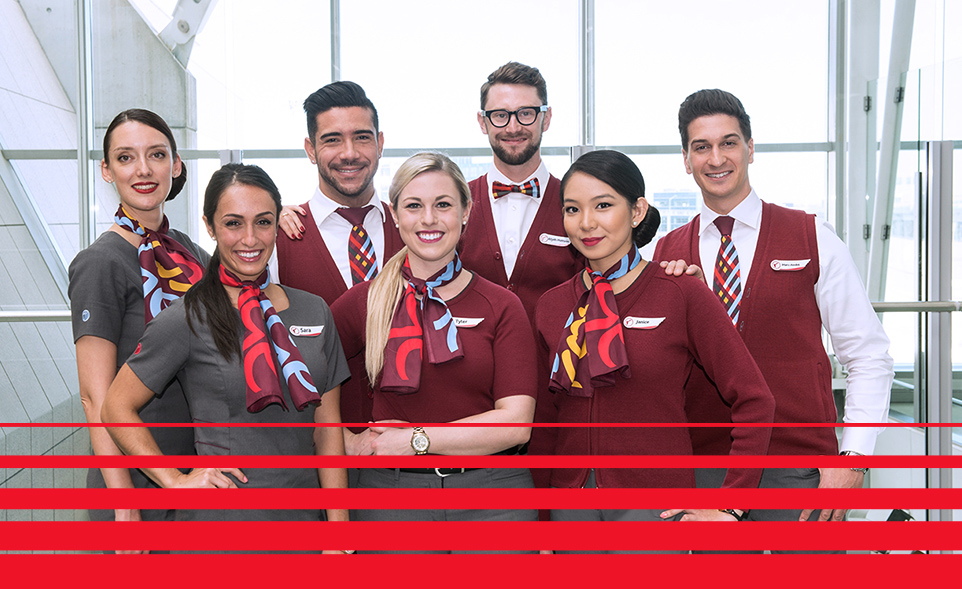 Group shot of Rouge flightcrew from inside an aircraft.